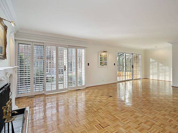 Living room with sliding doors leading to the private patio or solarium.