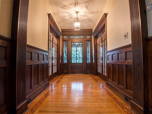 Long (34x8) entry hall with beautiful leaded glass front door and pocket doors offer privacy to both living rooms.  Original woo