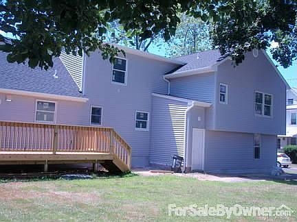 Rear of house : Large back yard, rear entrance from garage & back yard. New deck from kitchen.