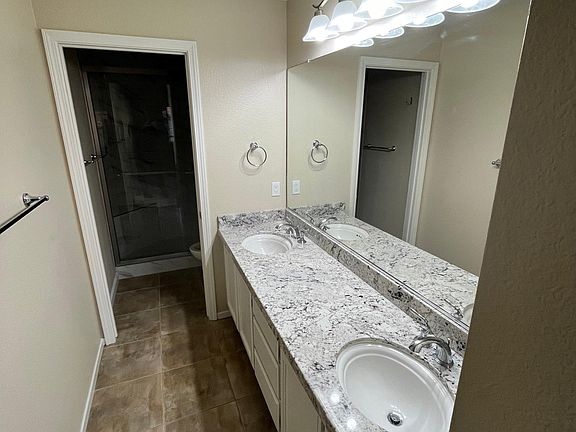 master bathroom - new shower - granite top - new lights, fan & paint