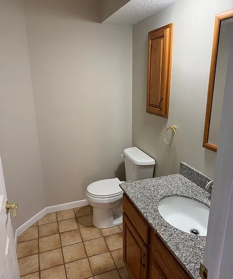 Half bath located at front entrance of the unit.
