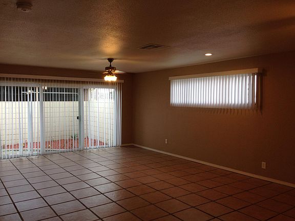 Tile has been removed from this extra-large room and has been replaced with vinyl plank flooring.