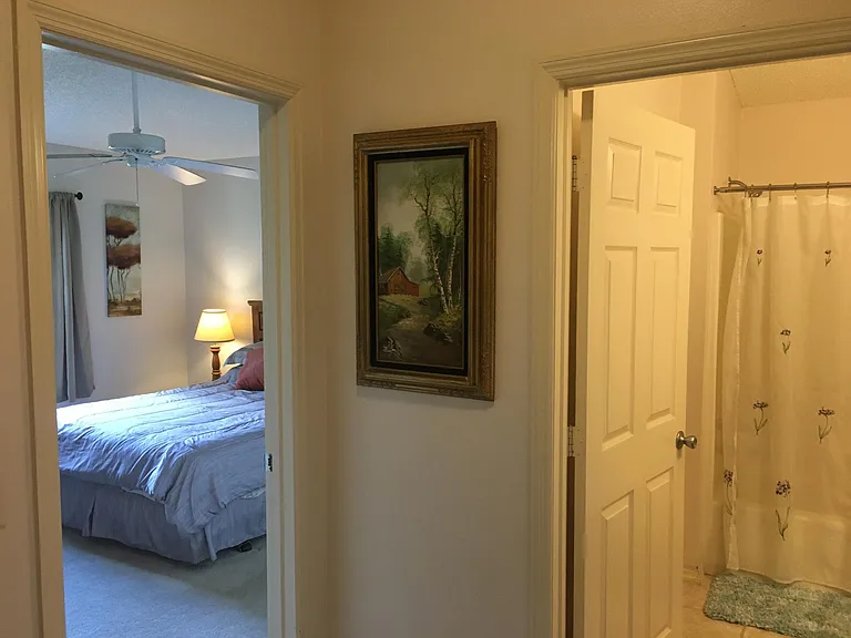 Guest Bedroom from hall and guest bath with full tub /shower
