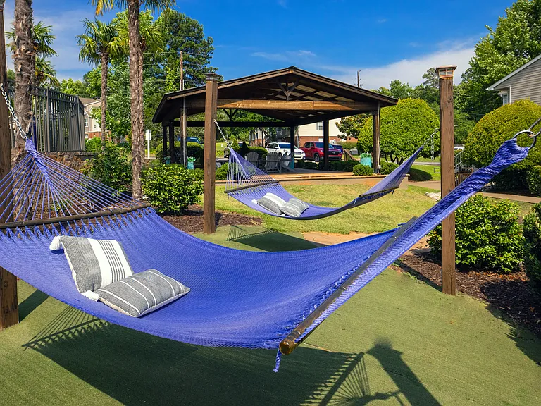 Indulge in tranquil moments as you unwind in our poolside hammocks for the epitome of relaxation.
