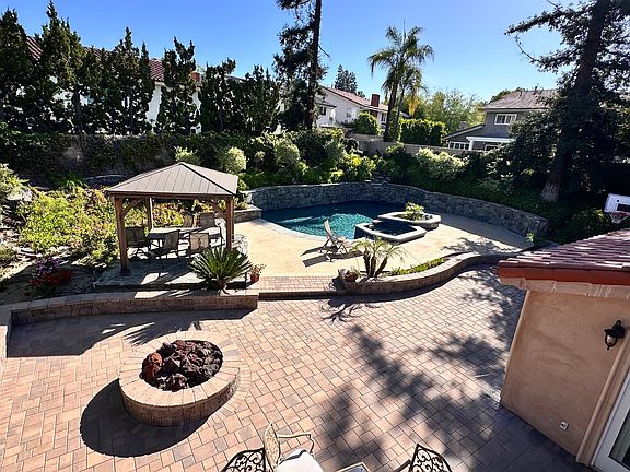 Massive back yard with pool, hot tub and gazebo