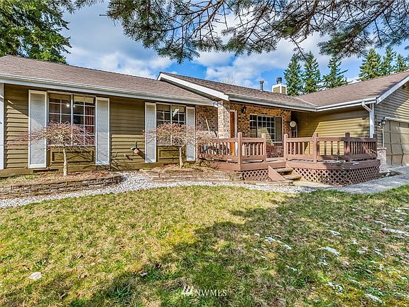 Single Story with Newer Roof, Brick Accents and Front Porch.