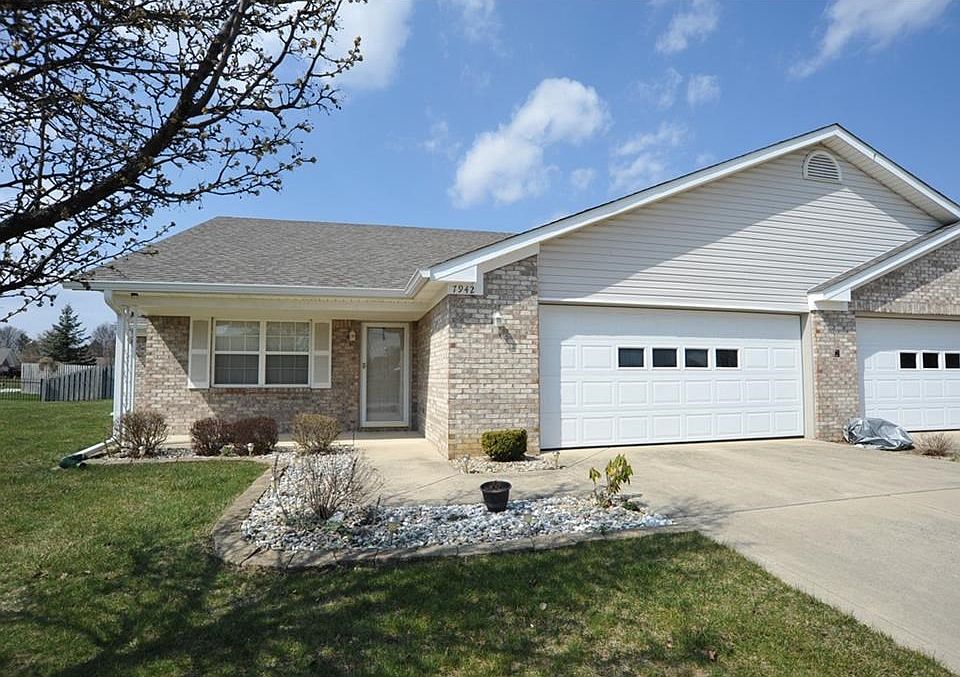 Covered front porch, and lovely landscaping.  New roof in 2014.