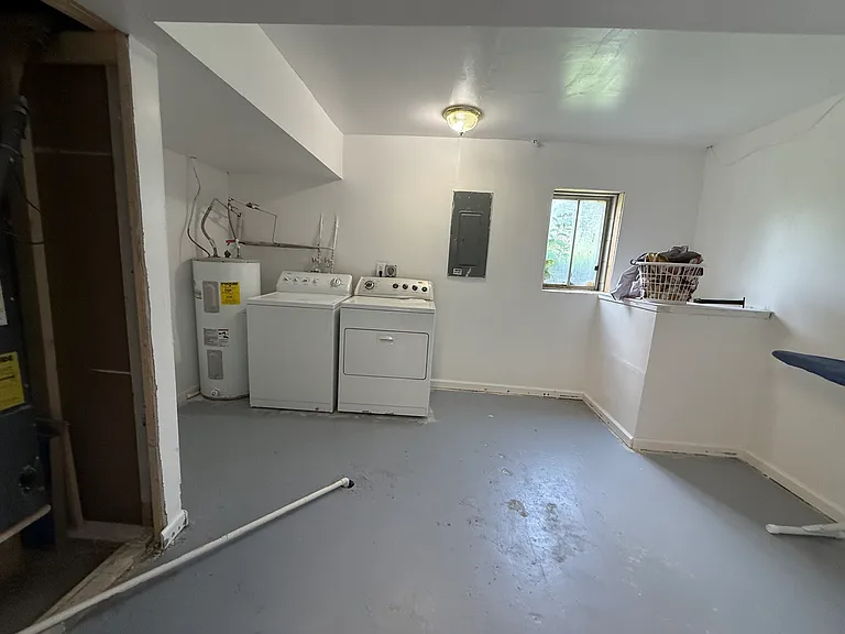 Huge laundry room showing washer and dryer