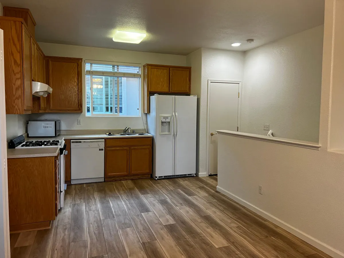 Nice kitchen with a window for light and gas range stove/oven, dish washer and lots of cabinet space. - 3944 Louis Krohn Dr