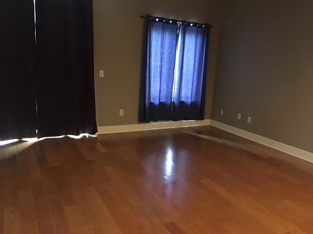 Open Living Area and Balcony Overlooking McBee Ave.