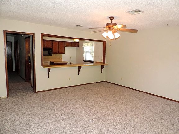 Living room/Dining room with pass-thru to kitchen.