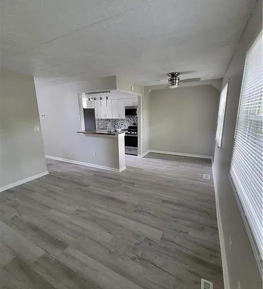 living room/dining space open to kitchen