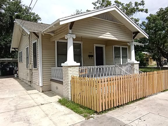 Driveway with covered parking space.