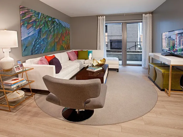 Living area with hard surface flooring and balcony