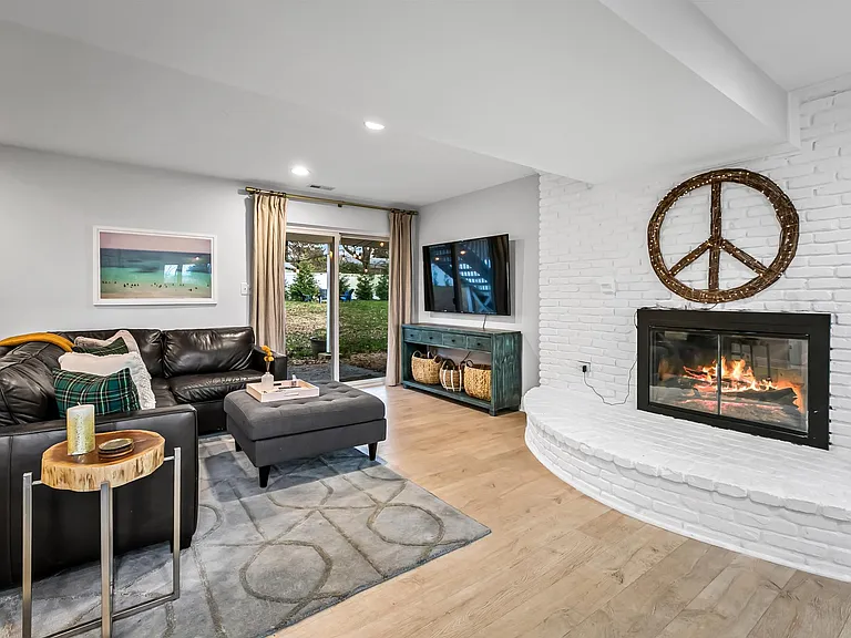 Cozy lower level with fireplace walks out to yard!