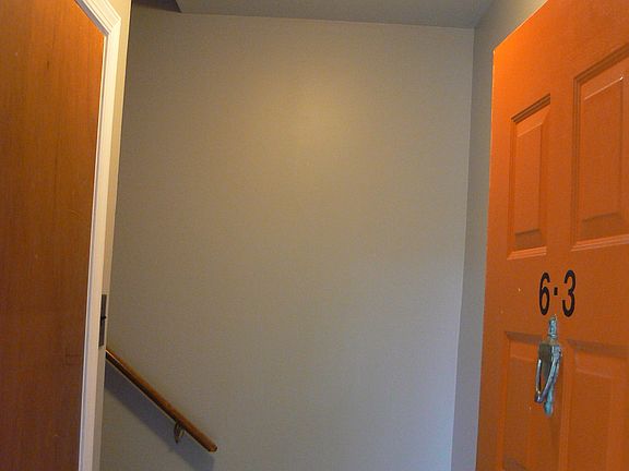 Enter to a large closet on your left and stairs up to first