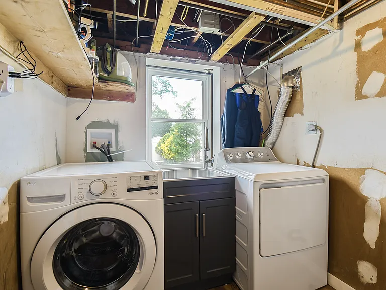 Laundry room, New washer, dryer, and stainless steel laundry sink