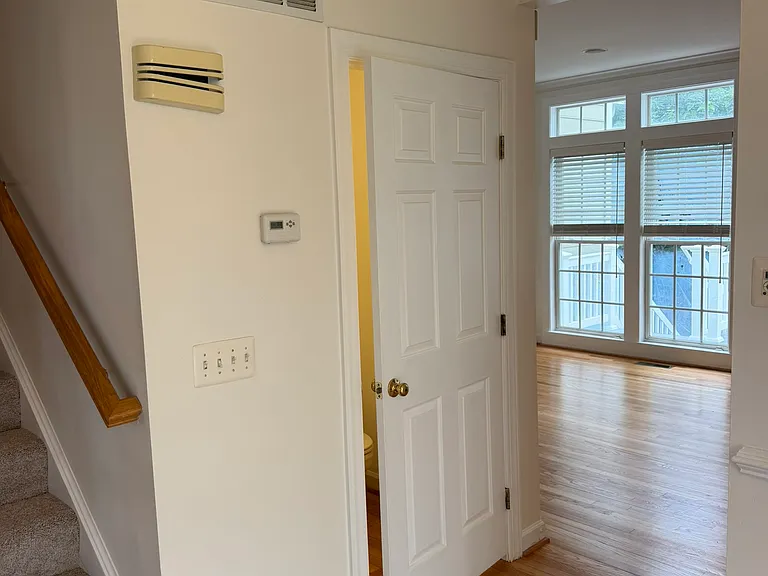 1/2 bath behind the closed door, kitchen to the right