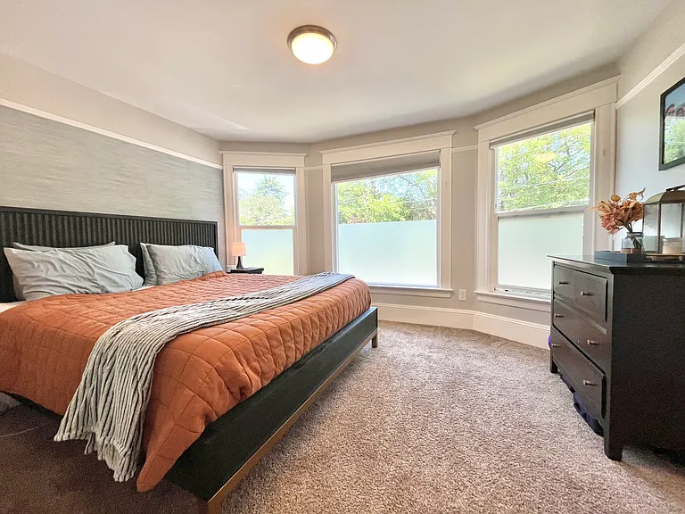 Massive primary suite complete with king-sized bed, ensuite bathroom and walk-in closet!