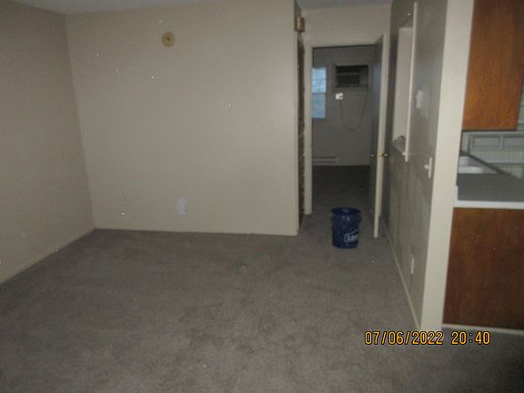 East side of Living Room and entry to Bedroom