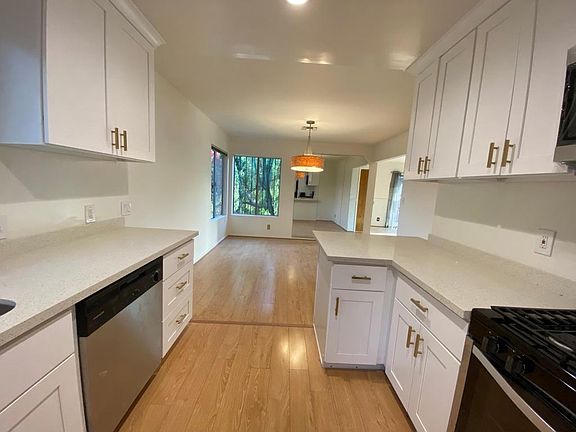 Kitchen with a peninsula opens to dining room