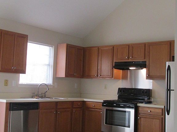 Bright Open Kitchen with Stainless Steel Appliance package