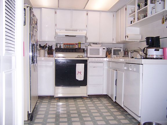 Beautiful tile counters and all appliances included, eating area not shown