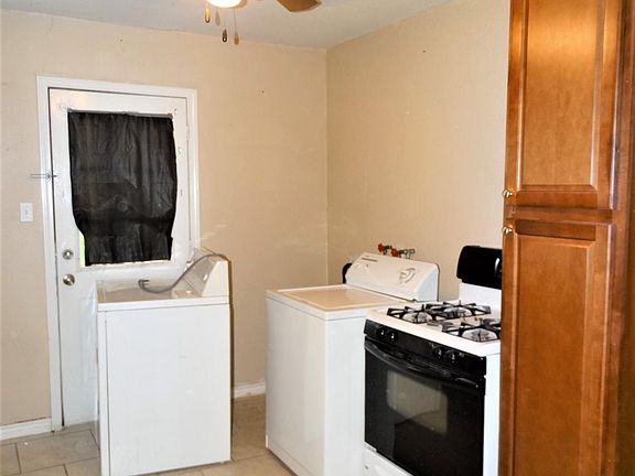 Comes with refrigerator, gas stove, washer & dryer.