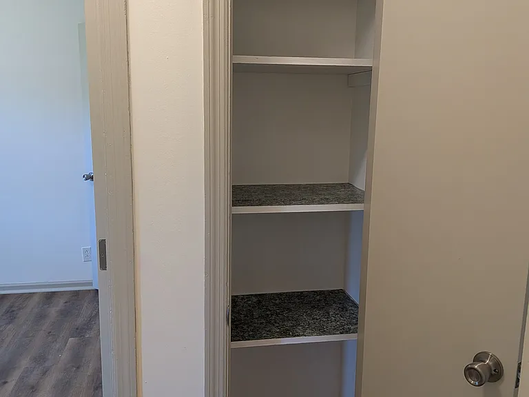 Hall closet (across from bathroom)