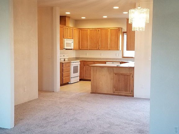 Living area looking through the dining room into the kitchen