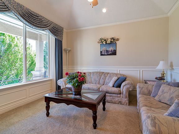 Inside front door to left