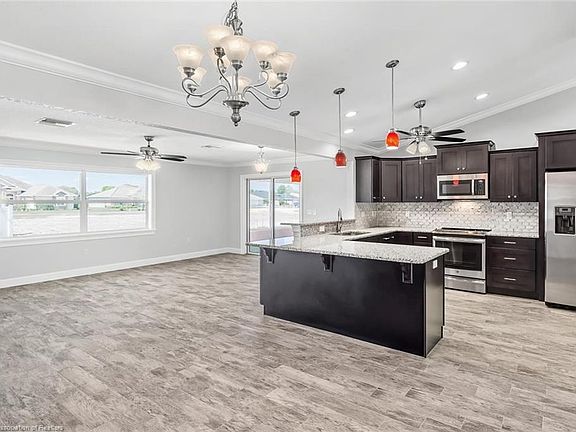 Kitchen is heart of this home, open to family and dining rooms.  Great for entertaining.