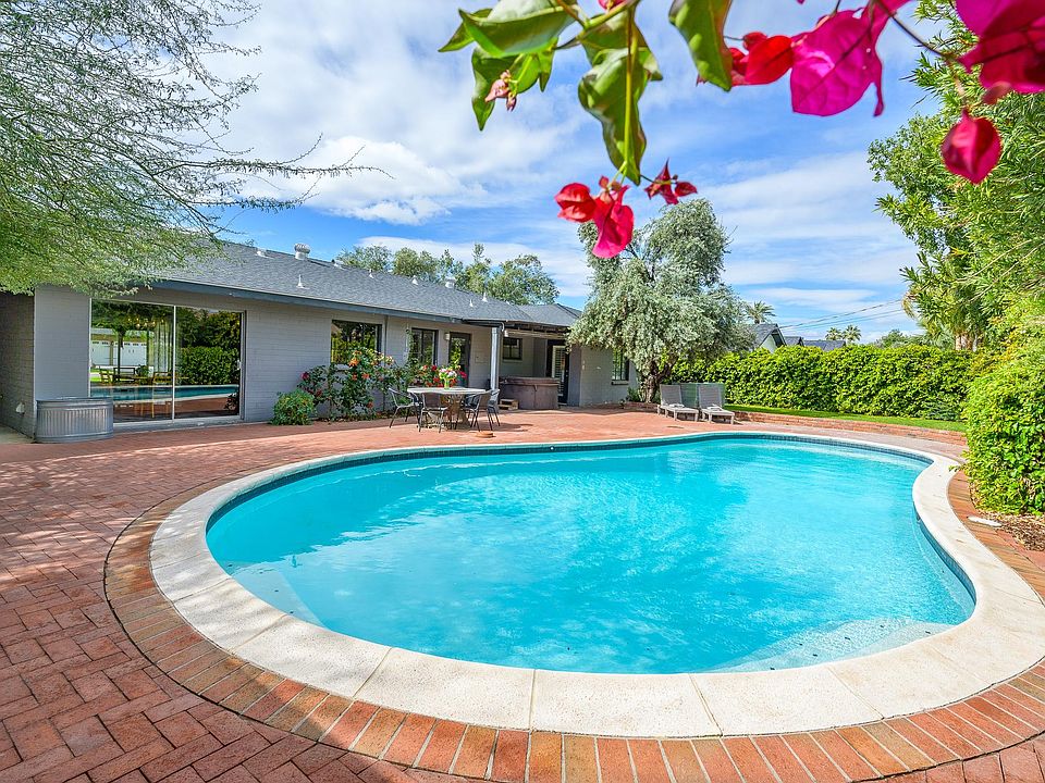 Pool looking at back of house. Slopes from 4ft to 9 ft at bottom.