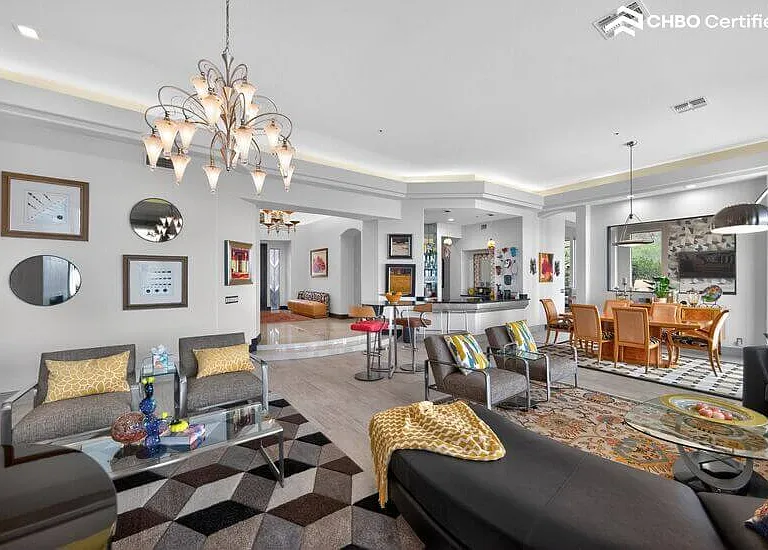 Art deco details & hidden lighting illuminate 14 ft ceilings