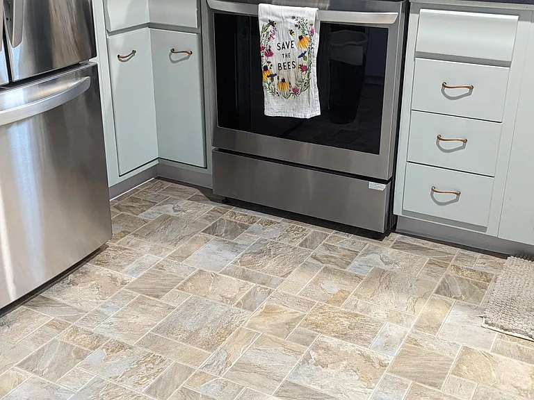 Kitchen flooring complements the hardwoods throughout the rest of the home.