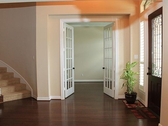 To the right of the Entry, you'll find a spacious Study w/French doors. Perfect for your in-home off