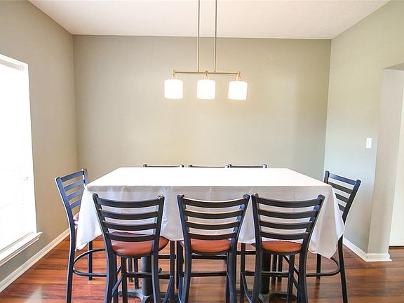 Dining room with lots of light and beautiful wood floors