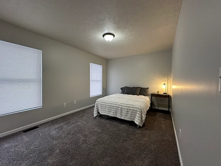 (3-Bedroom 1.5 Bath Unit )Front Bedroom - Freshly painted and updated carpet.
