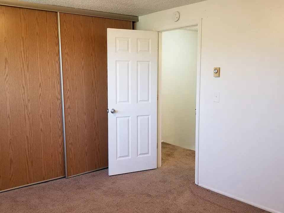 wall to wall closets in large bedroom