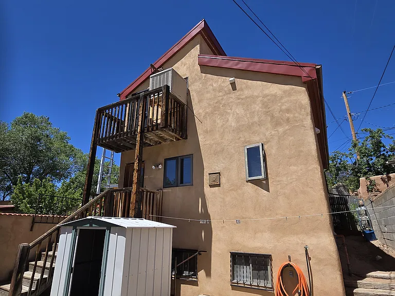 Rear of home with balconies