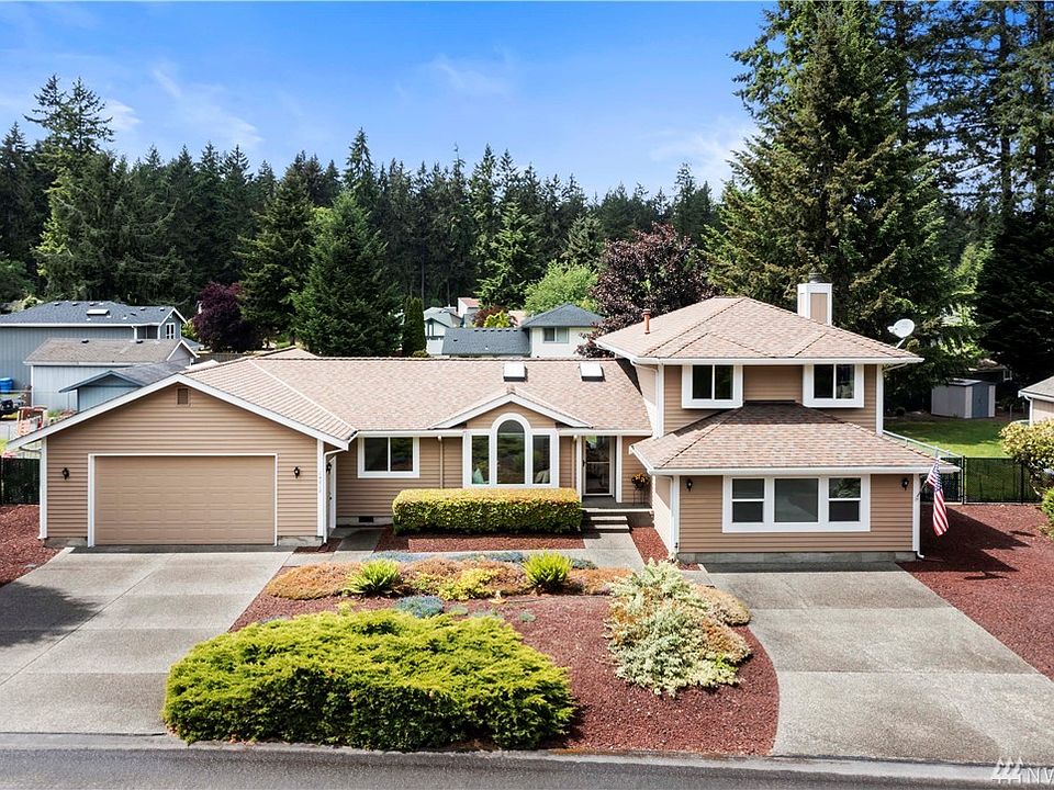 This impeccably maintained home offers plenty of parking and low maintenance landscape