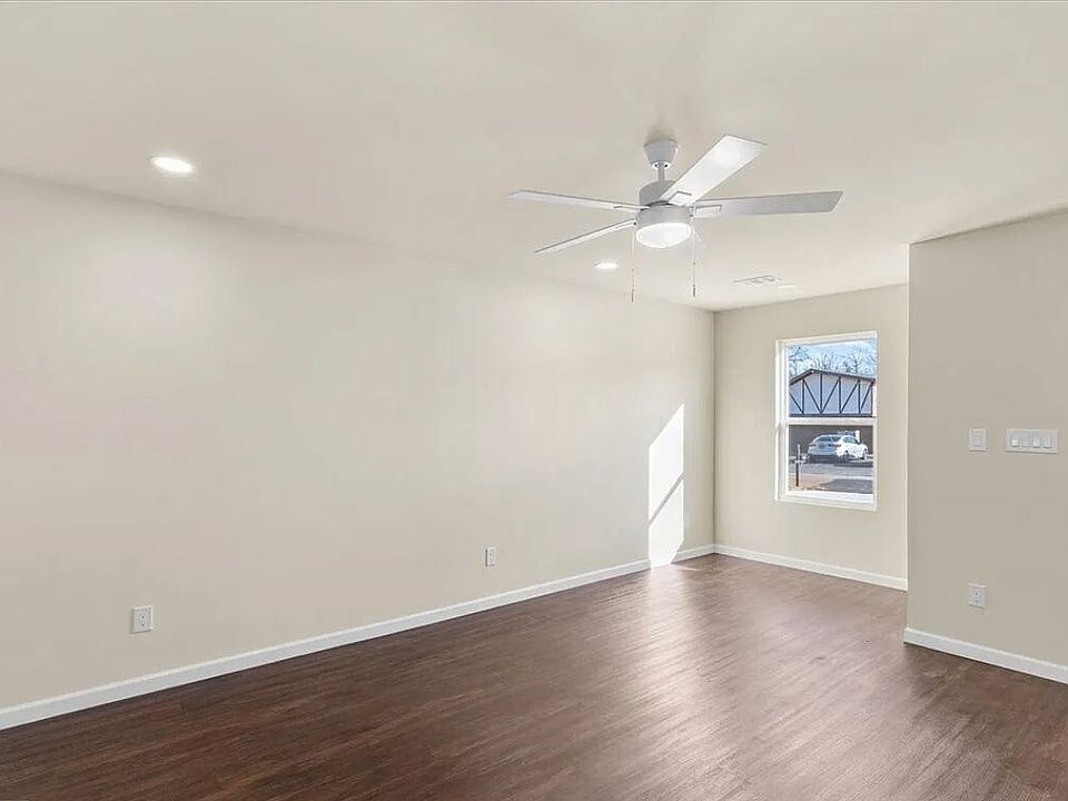 Living room with luxury vinyl flooring and dining nook or reading space