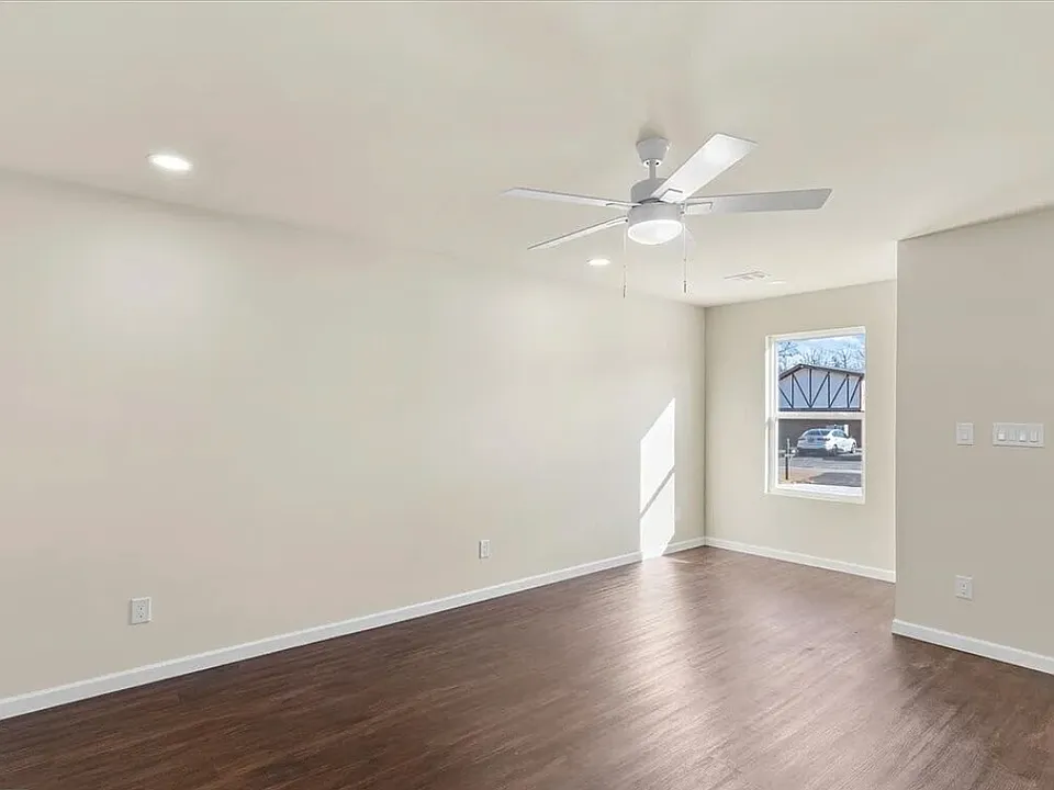Living room with luxury vinyl flooring and dining nook or reading space