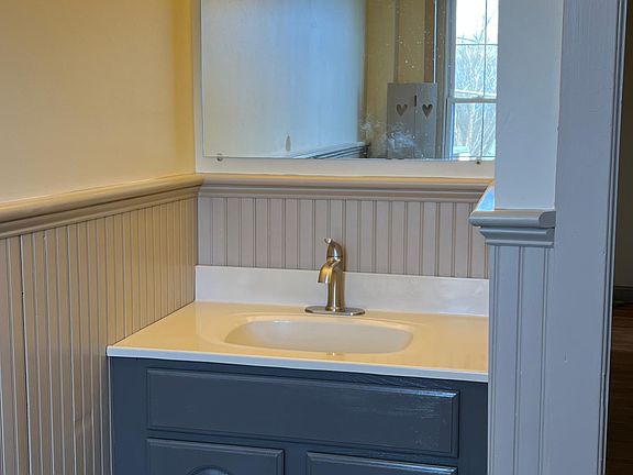 Bright and spacious bathroom with full size tub.