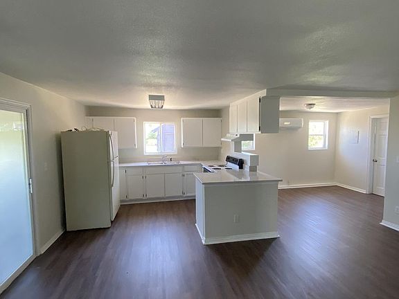 Kitchen with large open area for dining and possible home office space.
