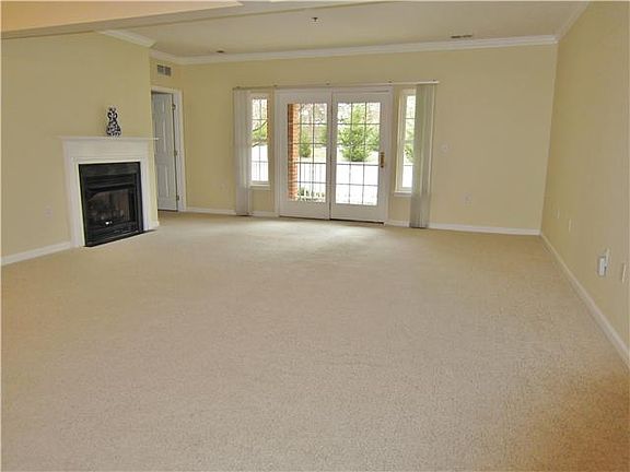 Living Rm with door to patio and the gas fireplace