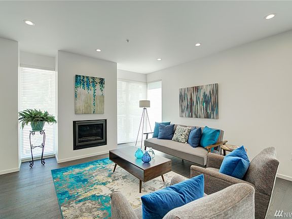 Sheer silhouette blinds allow the light in but maintain privacy. Recessed lighting is featured throughout the home. 