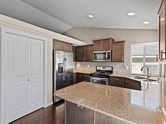 Kitchen with quartz counters and pantry