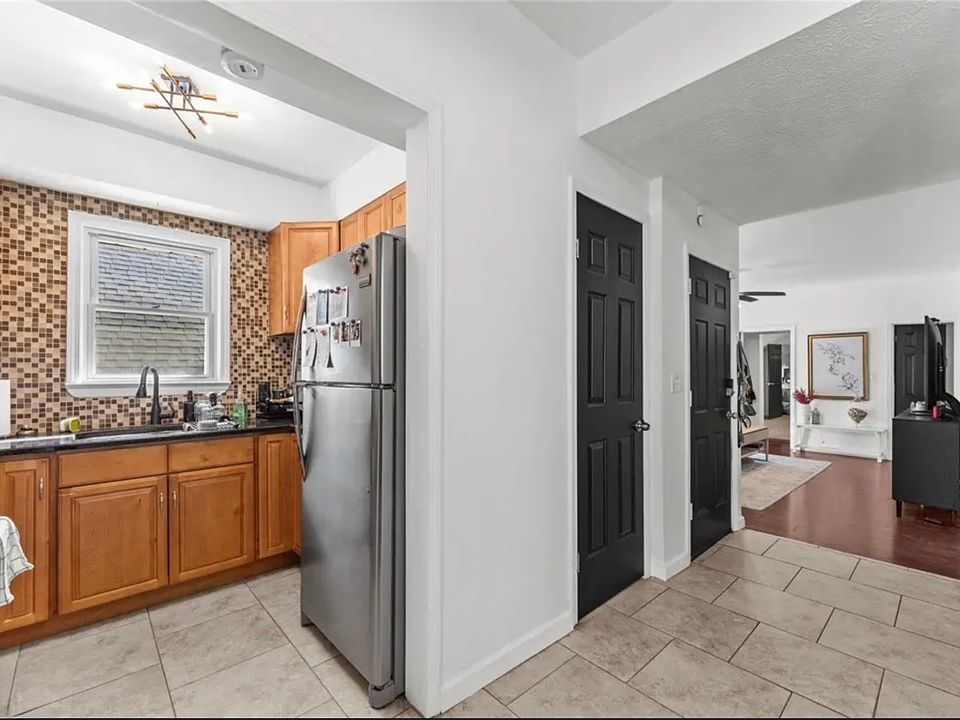Door on left goes up to the 3rd floor loft; Door on the right is the unit's front door.