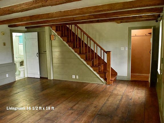 Living room with wide-plank floors